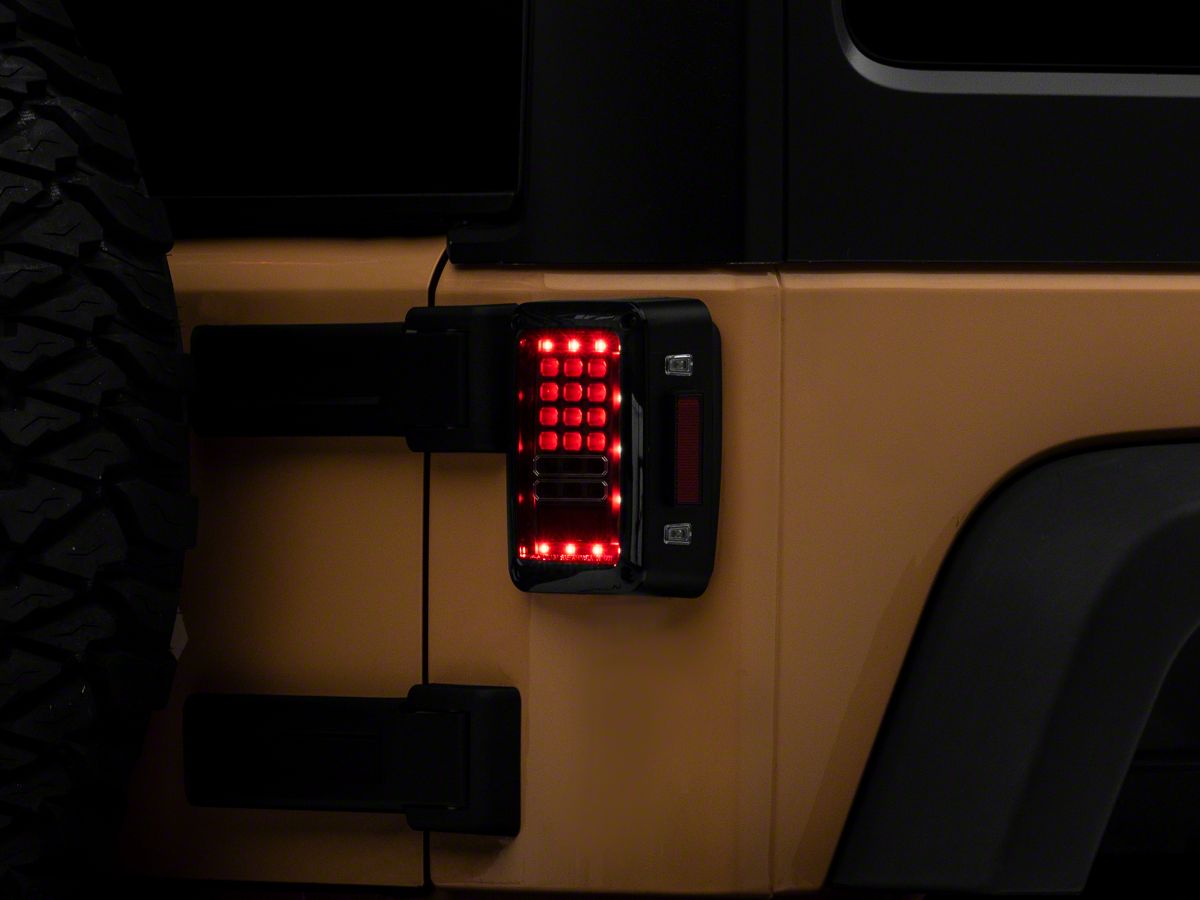 Raxiom Jeep Wrangler Axial Series LED Tail Lights; Black Housing; Clear  Lens J141585 (07-18 Jeep Wrangler JK) - Free Shipping